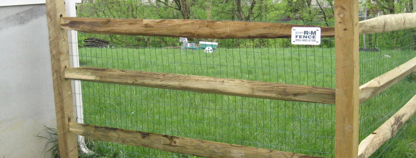 Split rail wood fence design in a scenic yard - R&M Fence