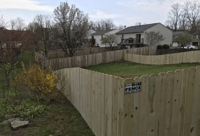 Long wood privacy fence defining a clear boundary
