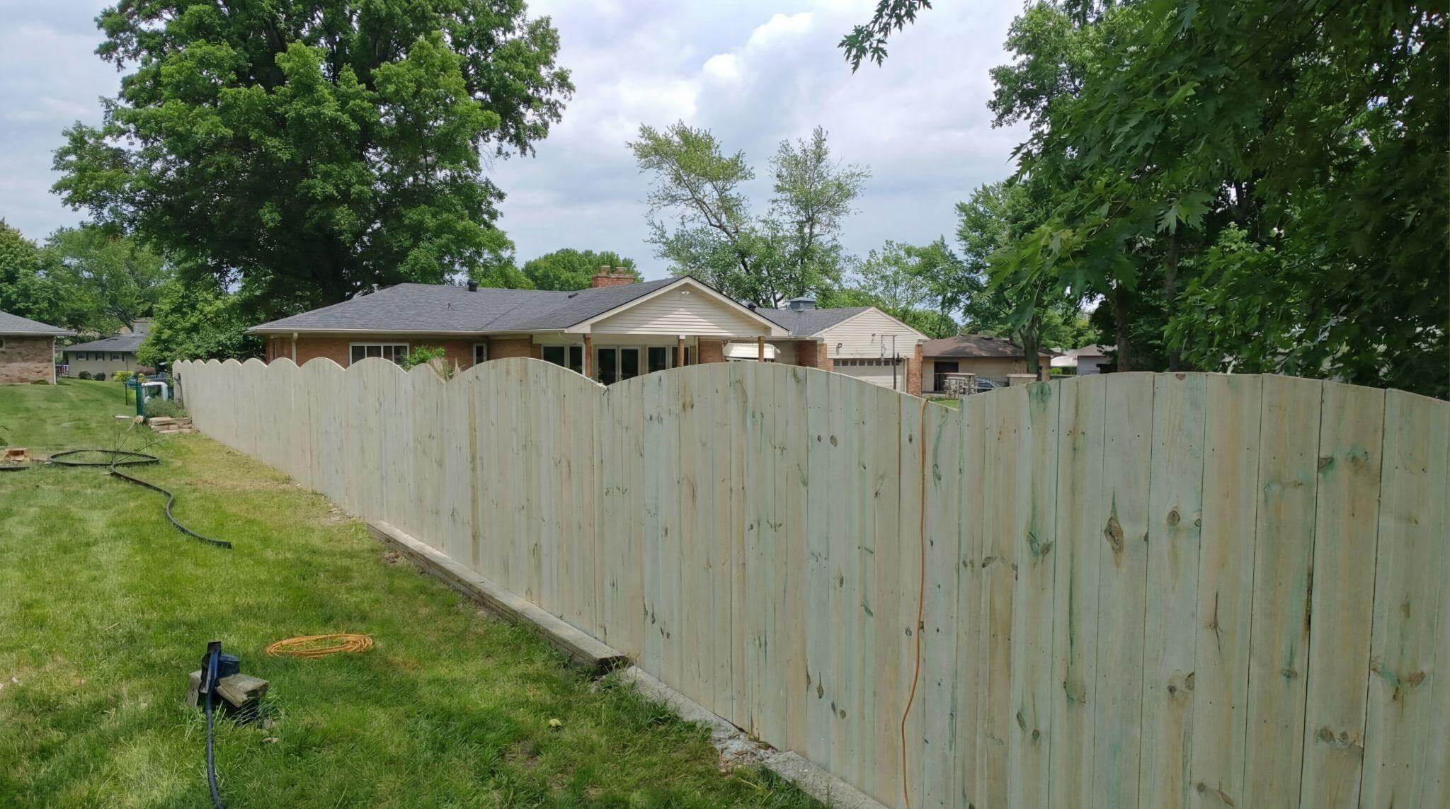 Tall wood privacy fence for pets installed in a Northern Kentucky backyard